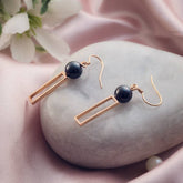 Golden Orb Elegance Ceramic Silver Earrings