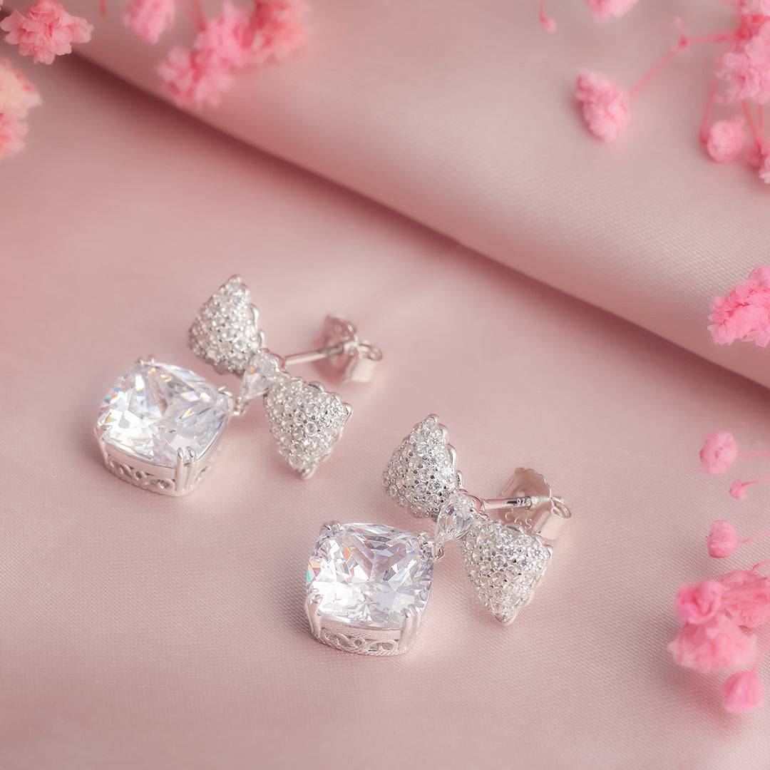 Intricate Bowtie Elegance Solitaire Silver Earrings